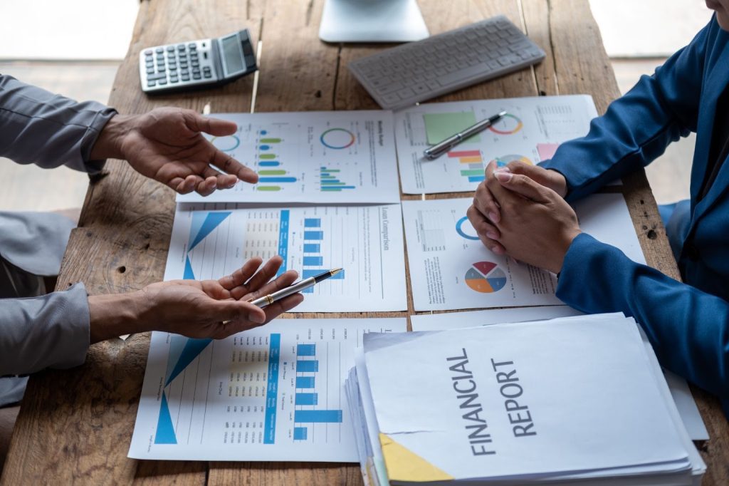 A group of accountants analysing the financial report
