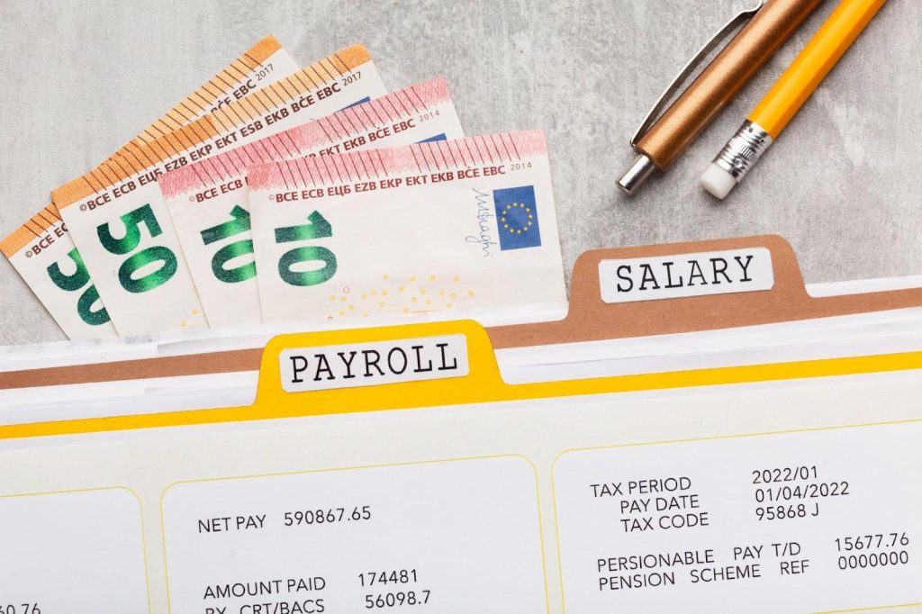 Payroll document with money