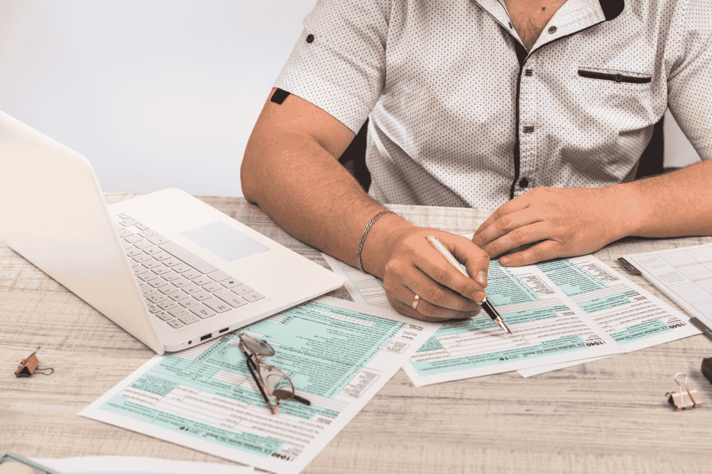 A man filling out tax forms
