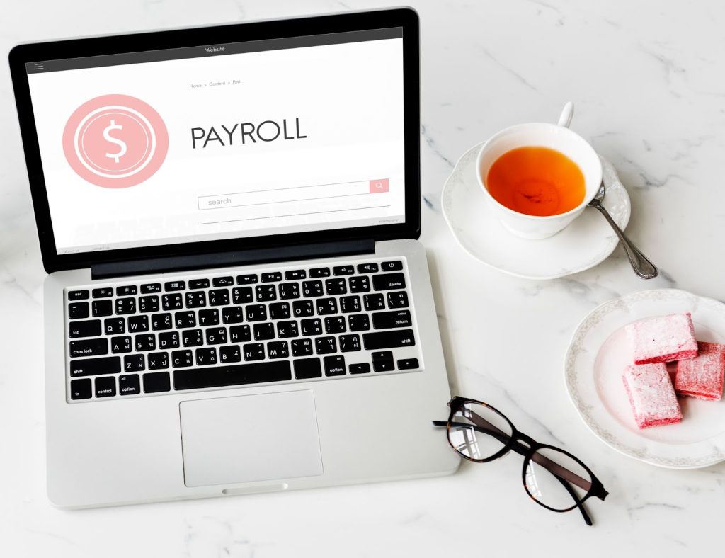 Laptop with Payroll written on it