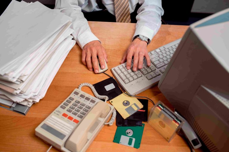 accountant working on a desktop computer