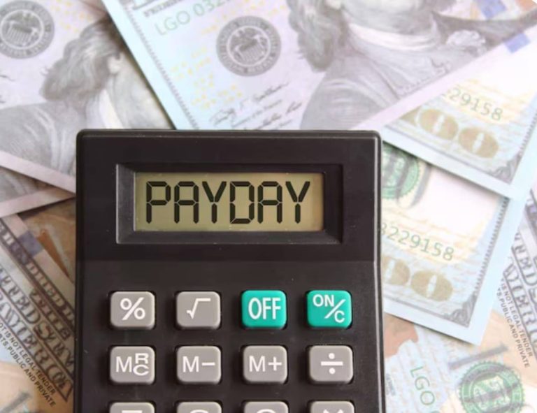 Money and a calculator on a table