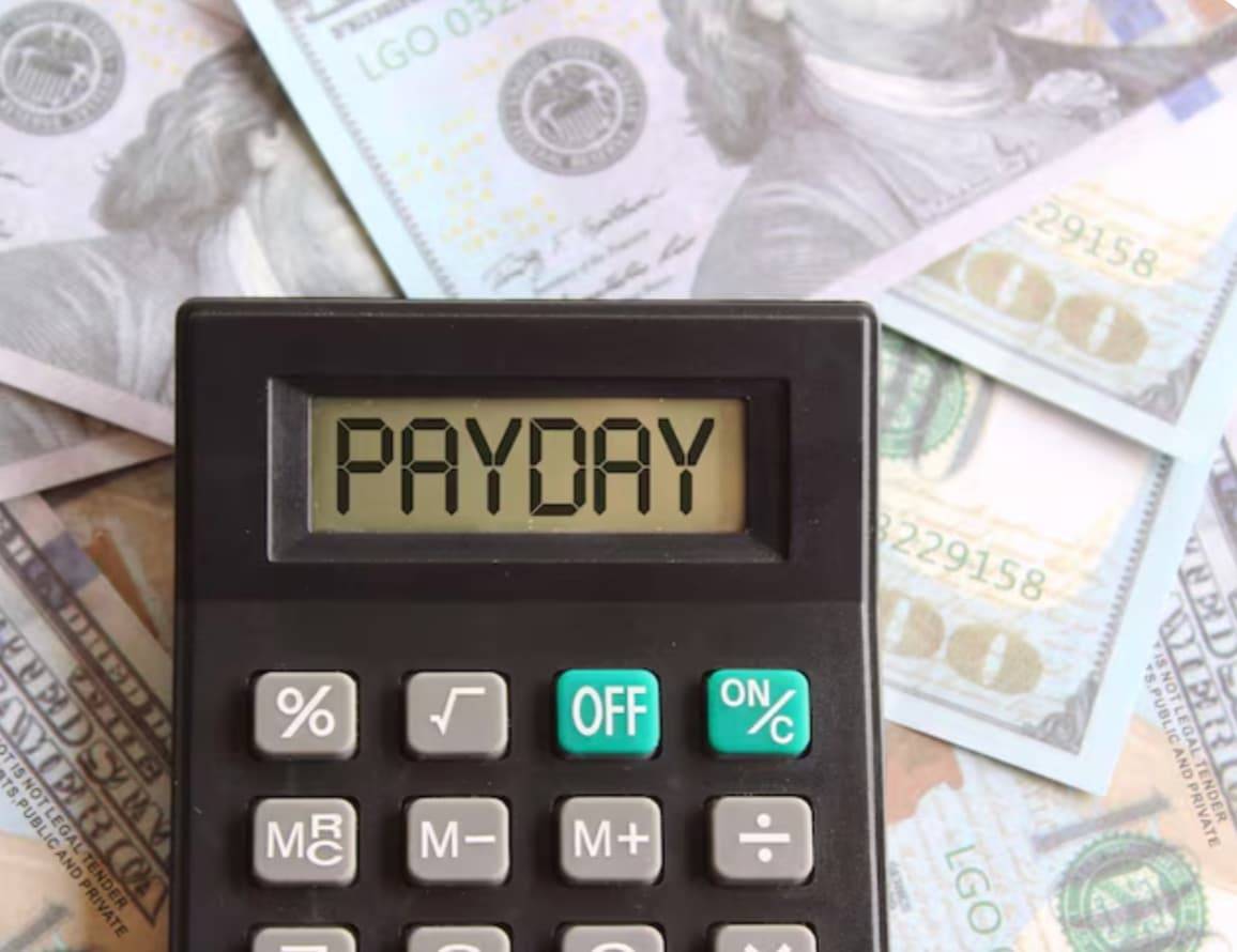 Money and a calculator on a table