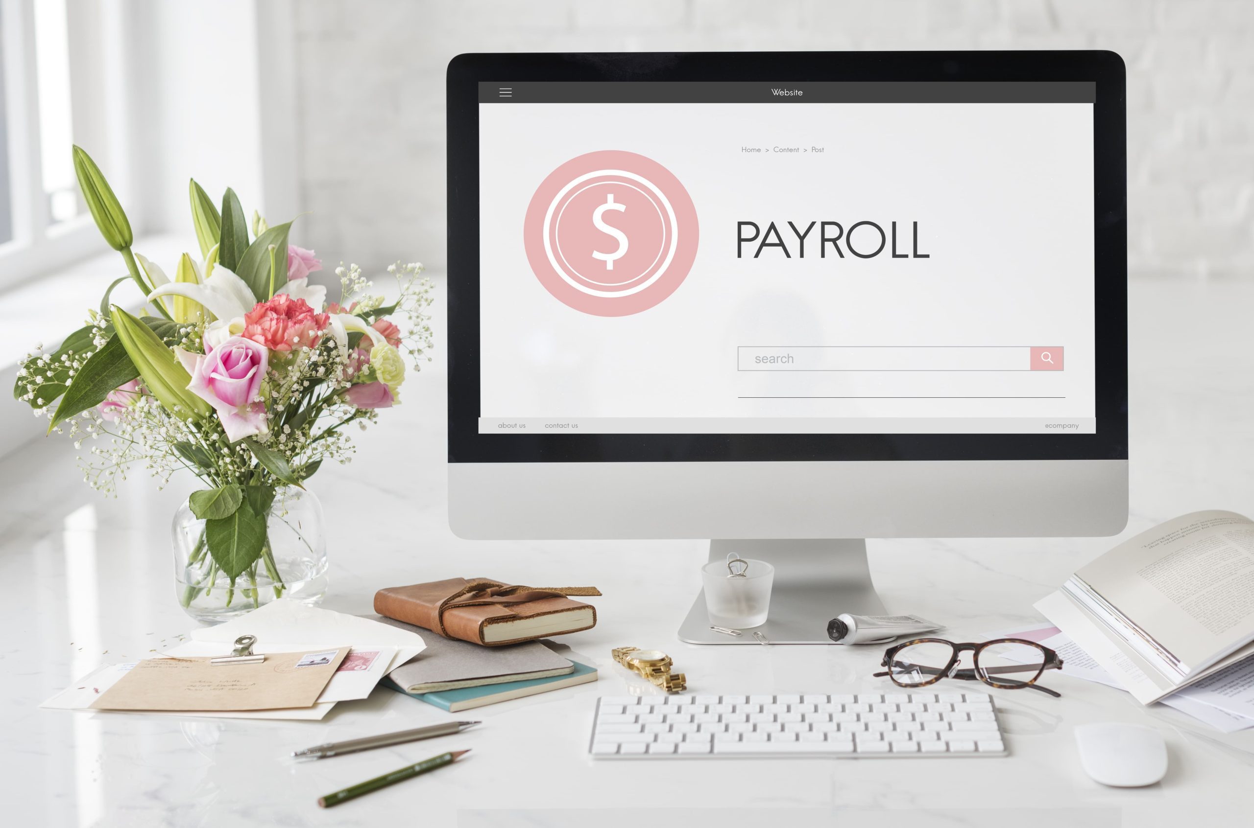 desktop with payroll rewritten on it