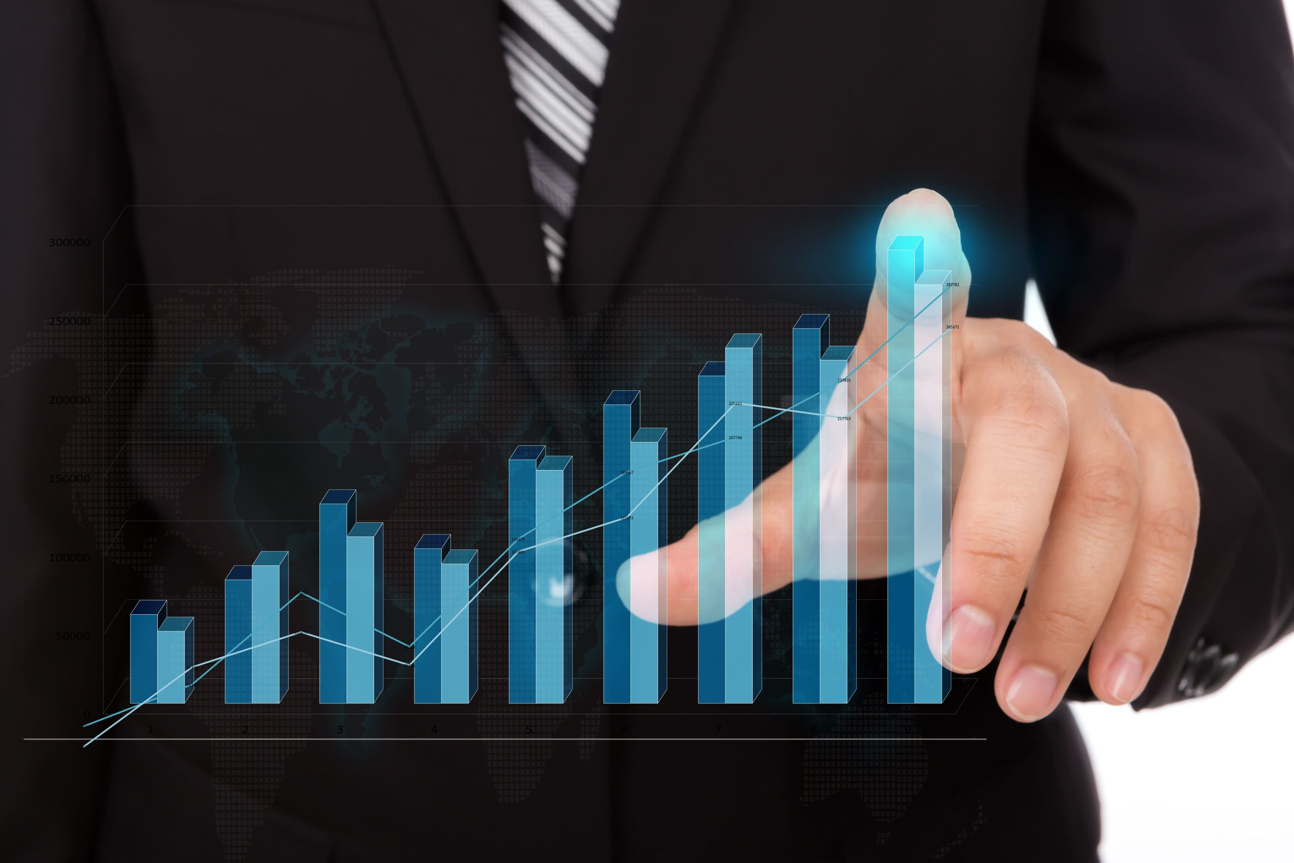 business man touching top bar of chart
