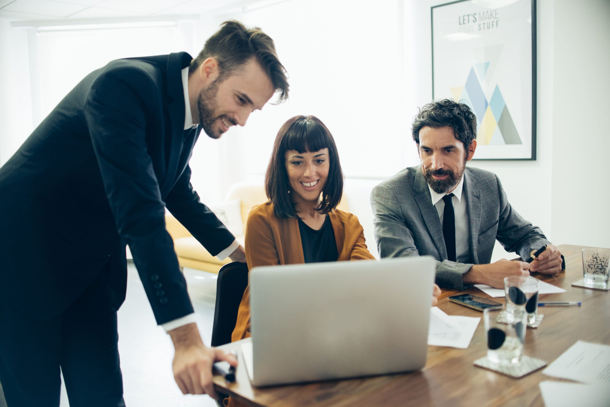 businessmen paying attention to report in laptop