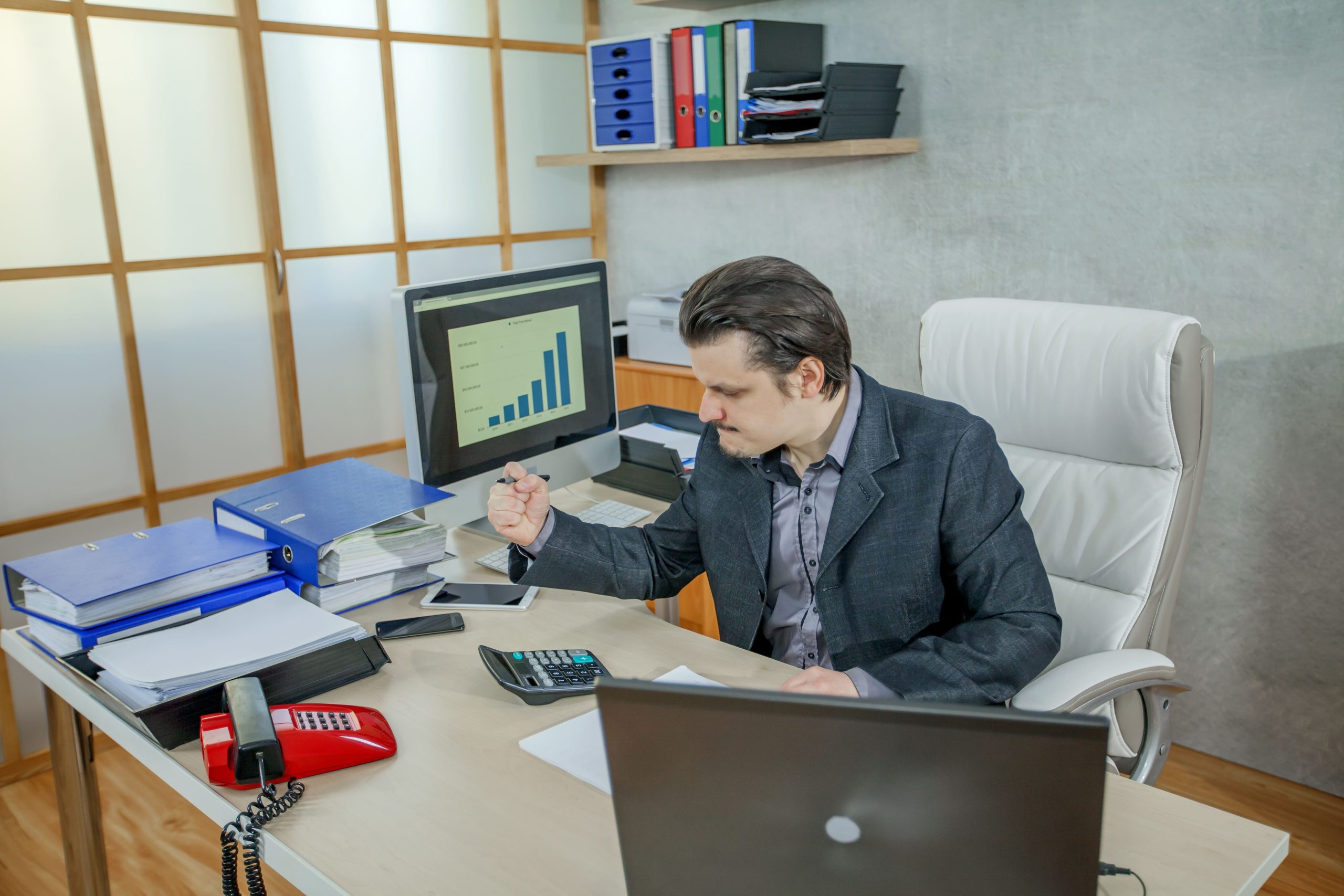 young business working from his office
