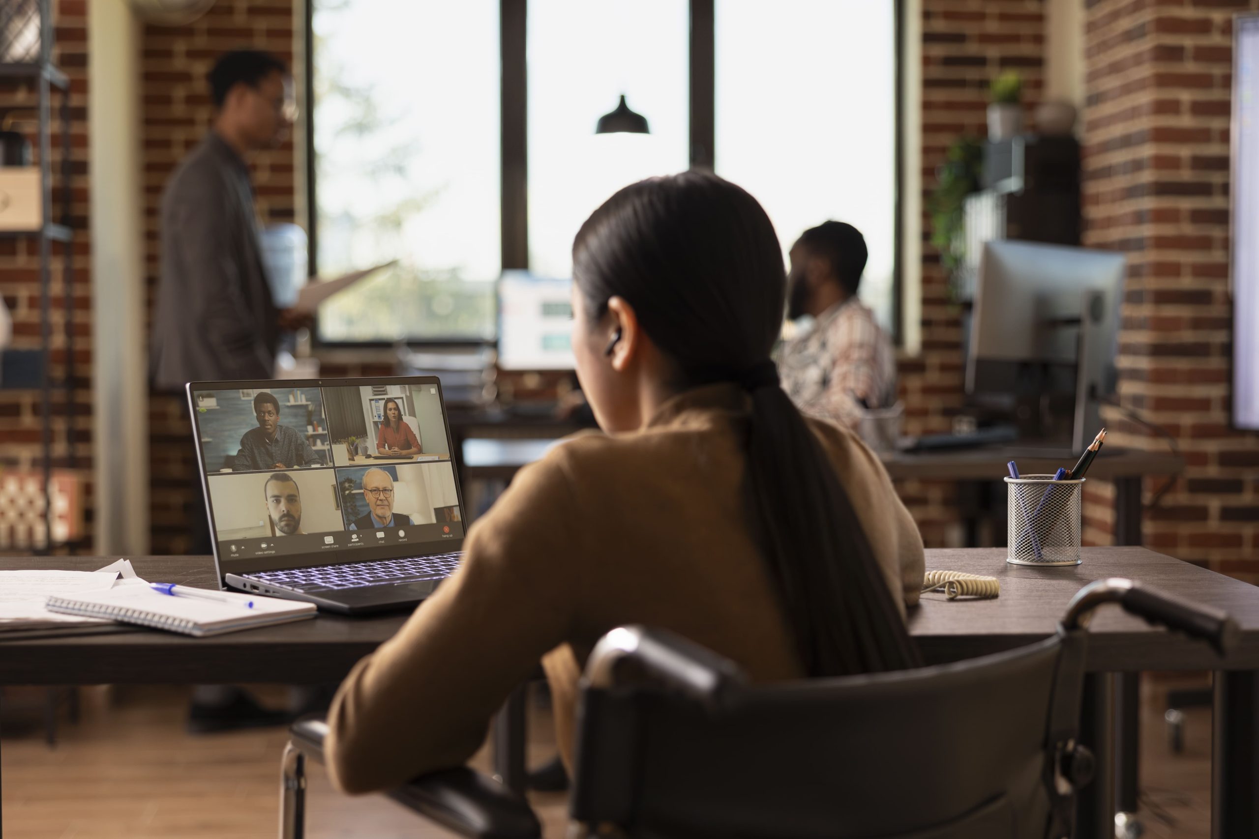 women in business suit taking video conference for shift employees